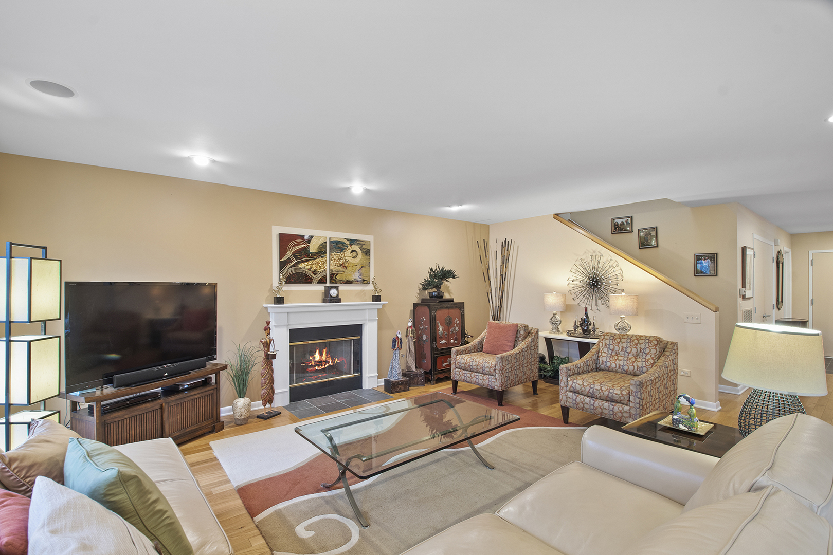 507 Kelburn Road Deerfield, IL 60015 - Photo 10 of 26 a living room with furniture a flat screen tv and a fireplace