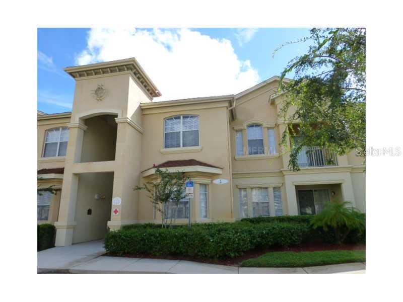 204 Terrace Ridge Circle, Unit 204 Davenport, FL 33896 - Photo 1 of 1 a front view of a house with garden