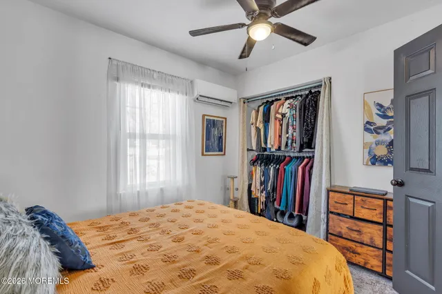 a kitchen with a table chairs refrigerator and cabinets