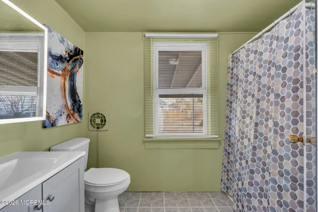 a view of a two chairs in the balcony