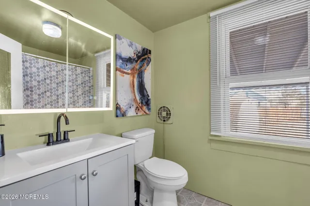 a view of balcony with two chairs and a potted plant