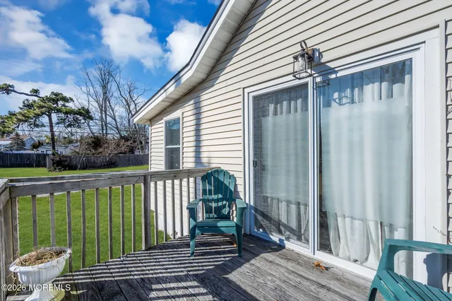 a view of a house with a yard porch and sitting area