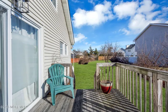 a view of a house with backyard sitting area and garden