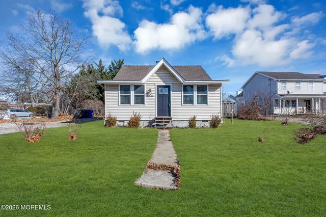 a view of livingroom with hardwood floor and hallway