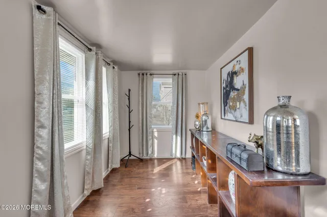 a view of an entryway with wooden floor