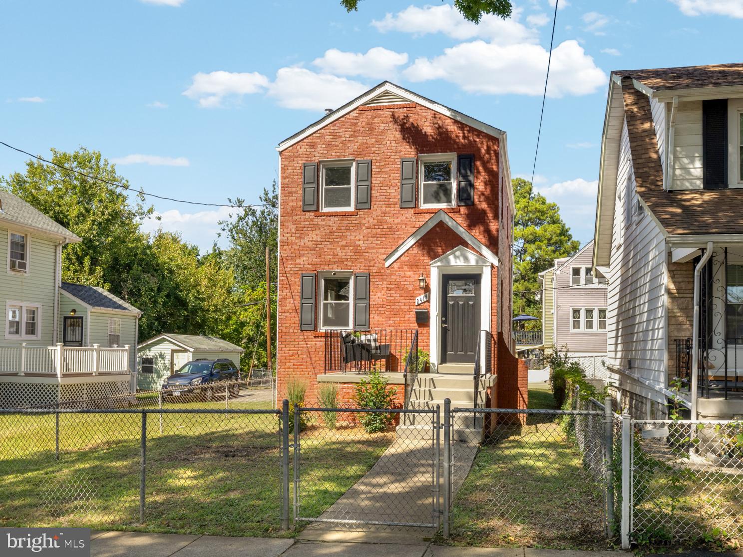 2414 Perry Street Northeast Washington, DC 20018 - Photo 1 of 49 a front view of a house with garden
