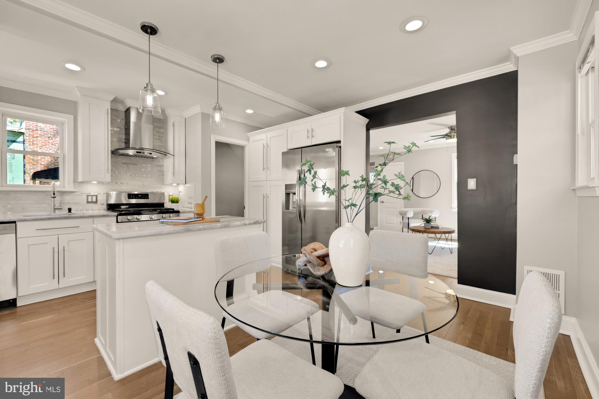 2414 Perry Street Northeast Washington, DC 20018 - Photo 14 of 49 a kitchen with white cabinets and white appliances