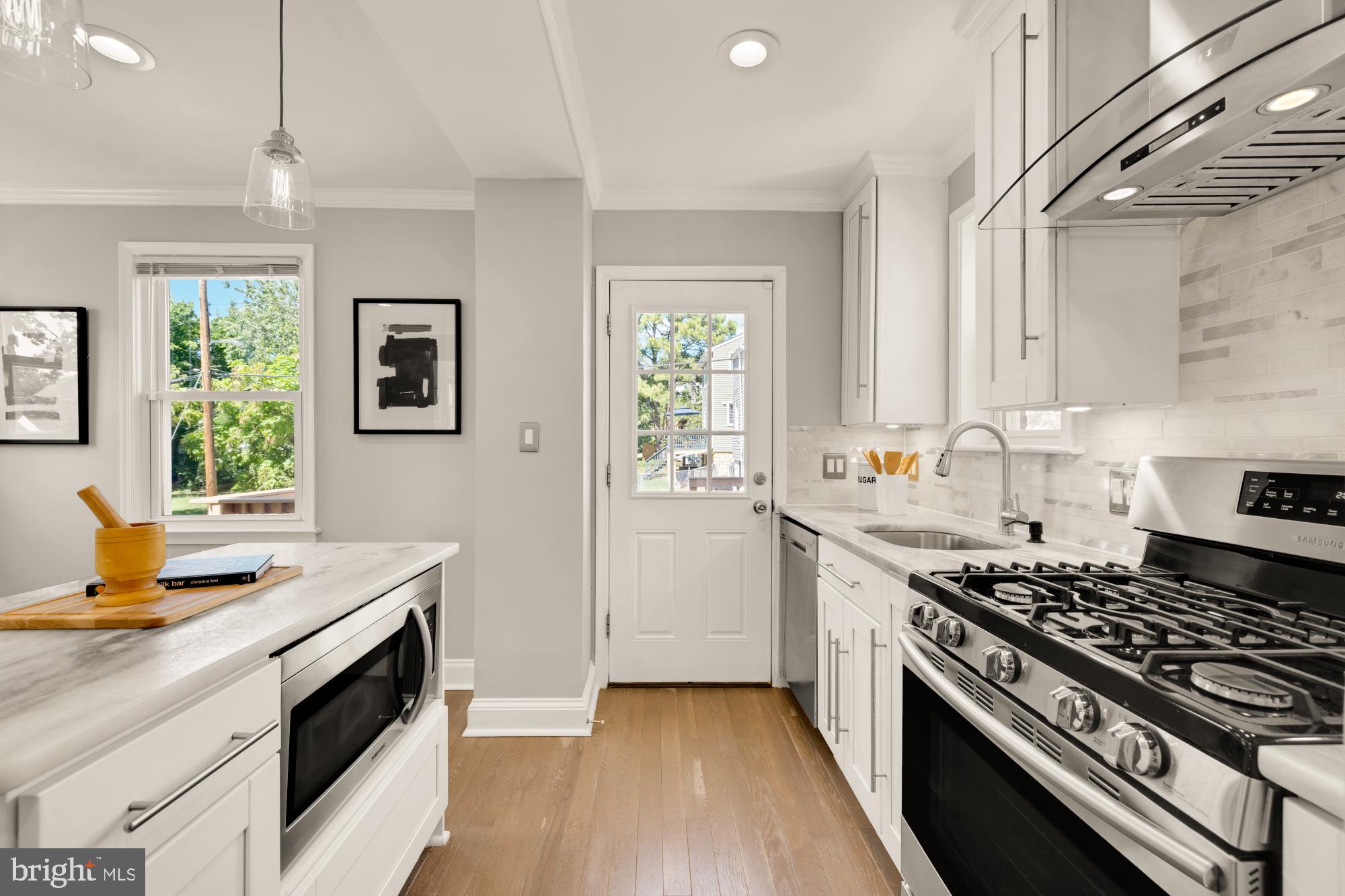 2414 Perry Street Northeast Washington, DC 20018 - Photo 18 of 49 a kitchen with a stove and a sink