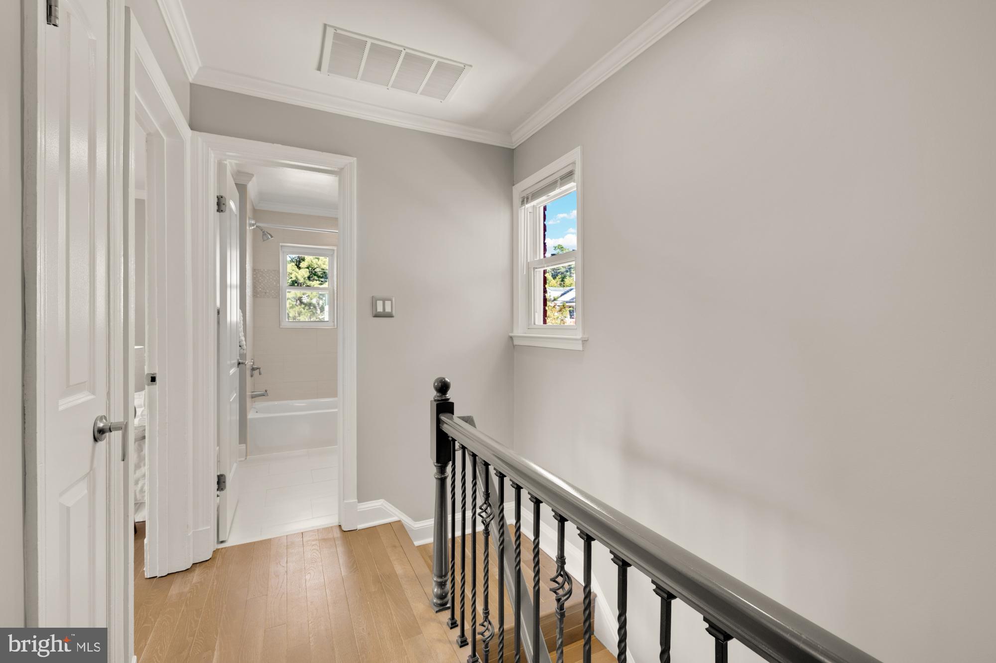 2414 Perry Street Northeast Washington, DC 20018 - Photo 23 of 49 a view of a hallway with wooden floor and a interior of the house