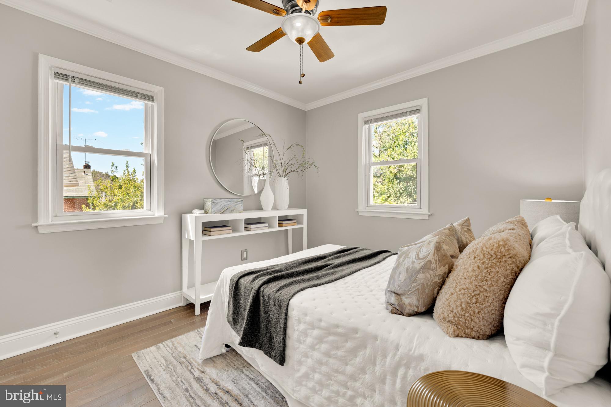 2414 Perry Street Northeast Washington, DC 20018 - Photo 25 of 49 a bedroom with a bed and a chandelier