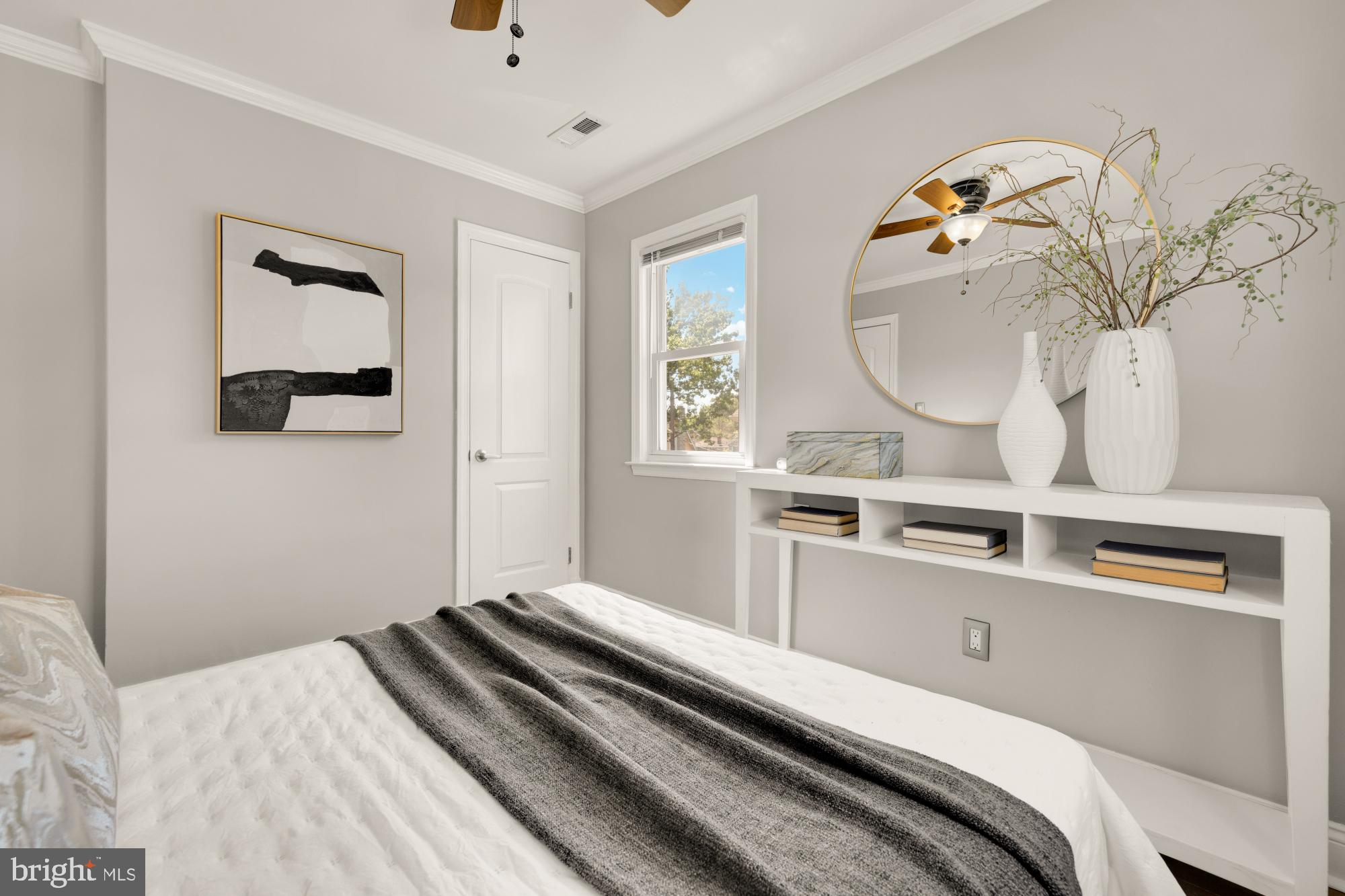 2414 Perry Street Northeast Washington, DC 20018 - Photo 27 of 49 a bedroom with a bed and a chandelier