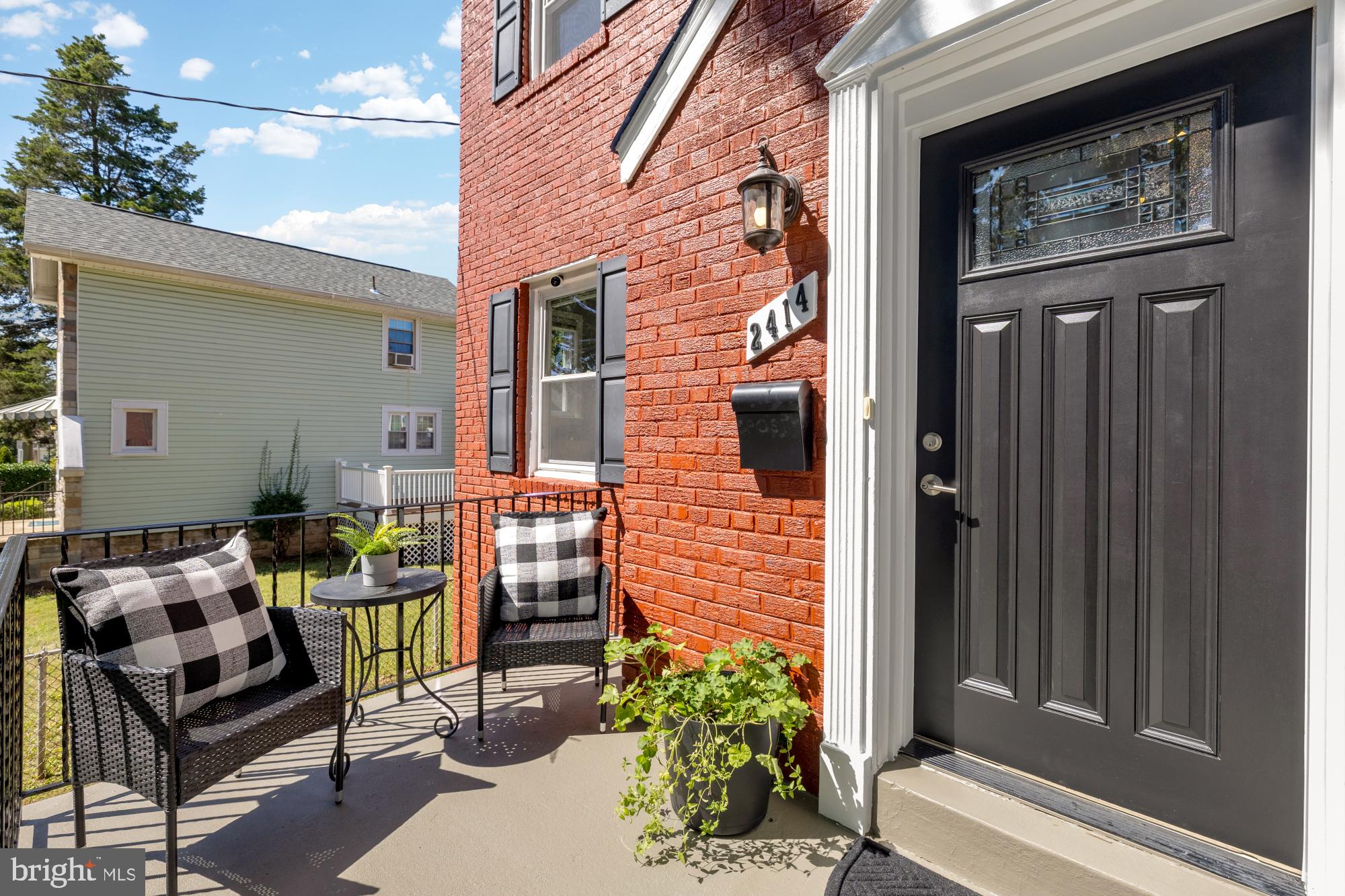 2414 Perry Street Northeast Washington, DC 20018 - Photo 3 of 49 a front view of a house with outdoor seating