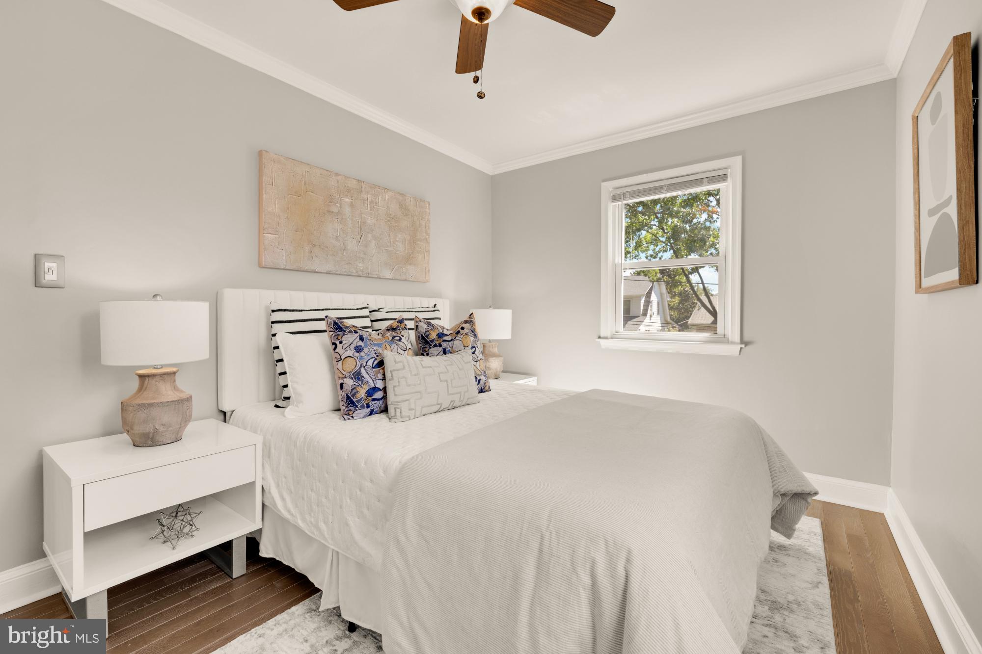 2414 Perry Street Northeast Washington, DC 20018 - Photo 32 of 49 a bedroom with a bed and a window