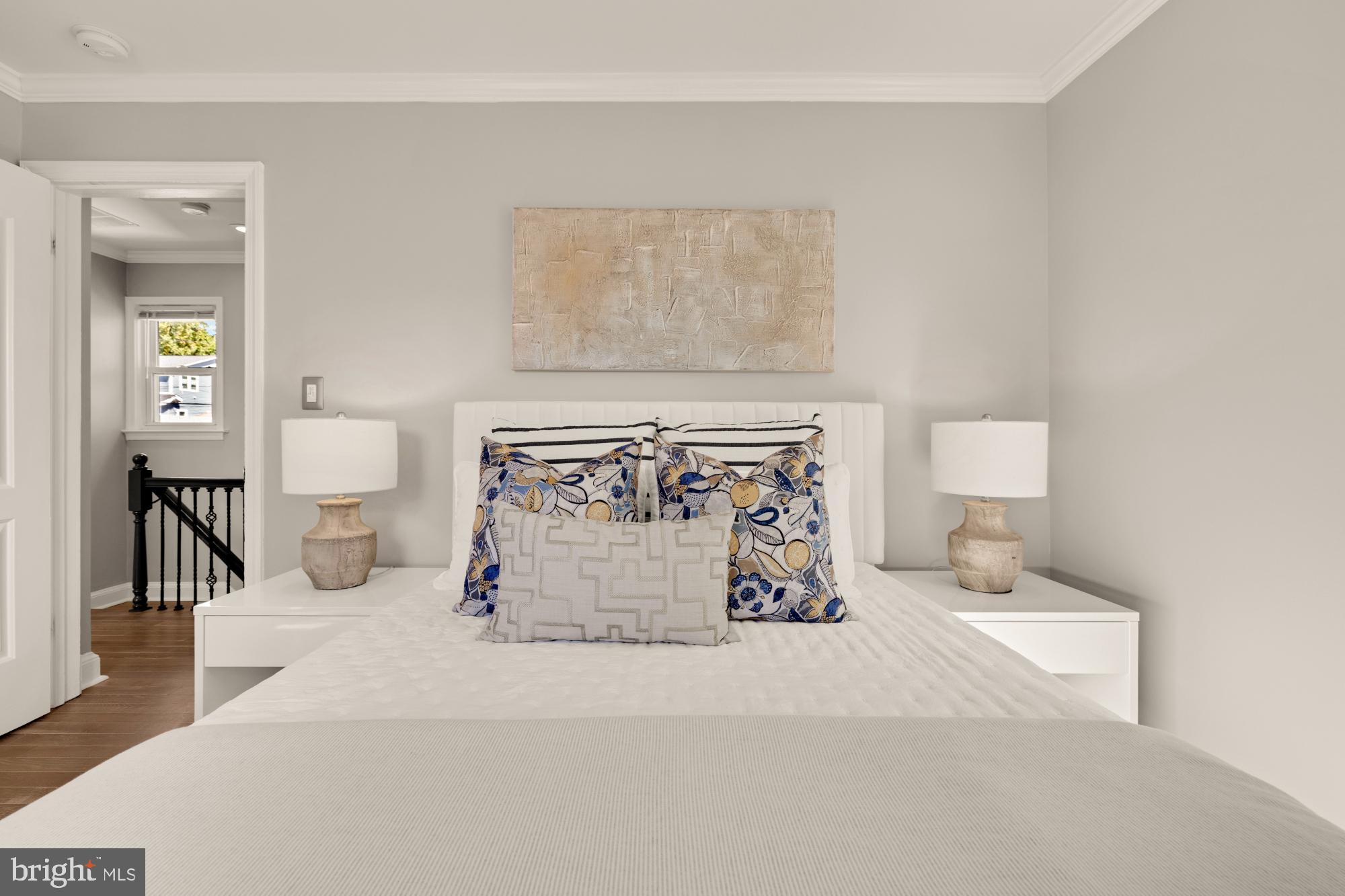 2414 Perry Street Northeast Washington, DC 20018 - Photo 33 of 49 a bedroom with a bed and a lamp