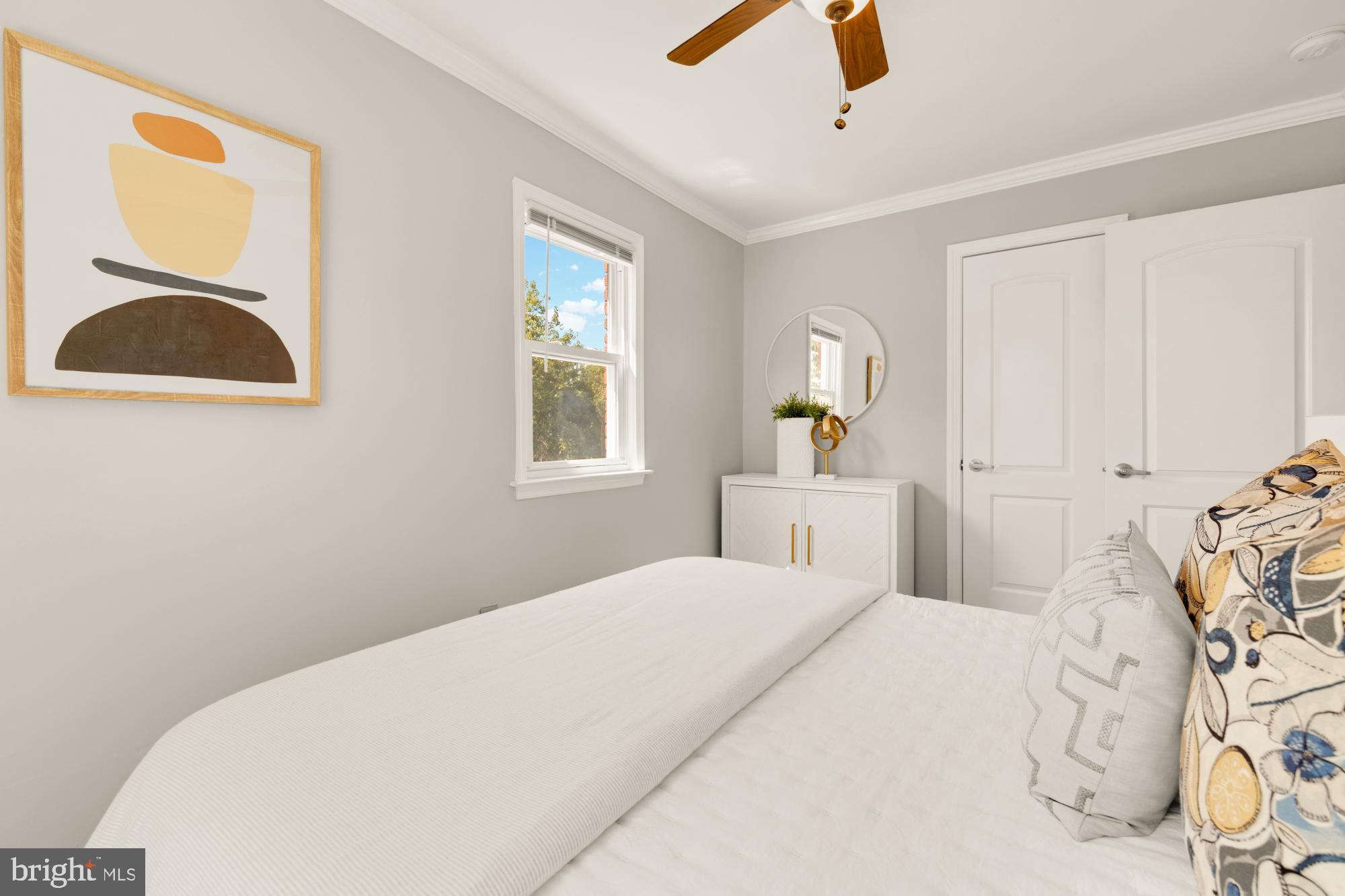 2414 Perry Street Northeast Washington, DC 20018 - Photo 34 of 49 a bedroom with a bed and a window