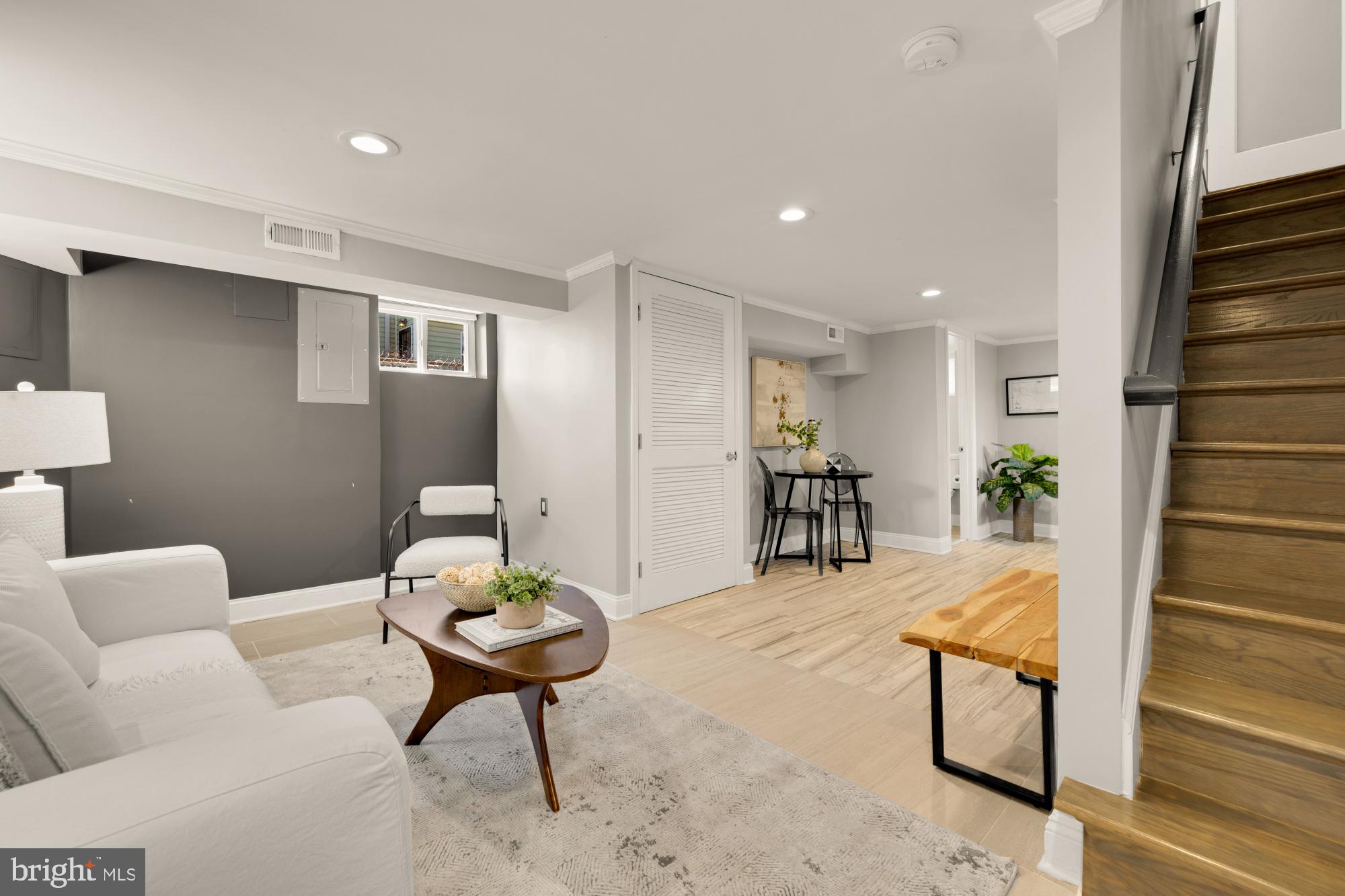 2414 Perry Street Northeast Washington, DC 20018 - Photo 35 of 49 a living room with furniture a rug and a table