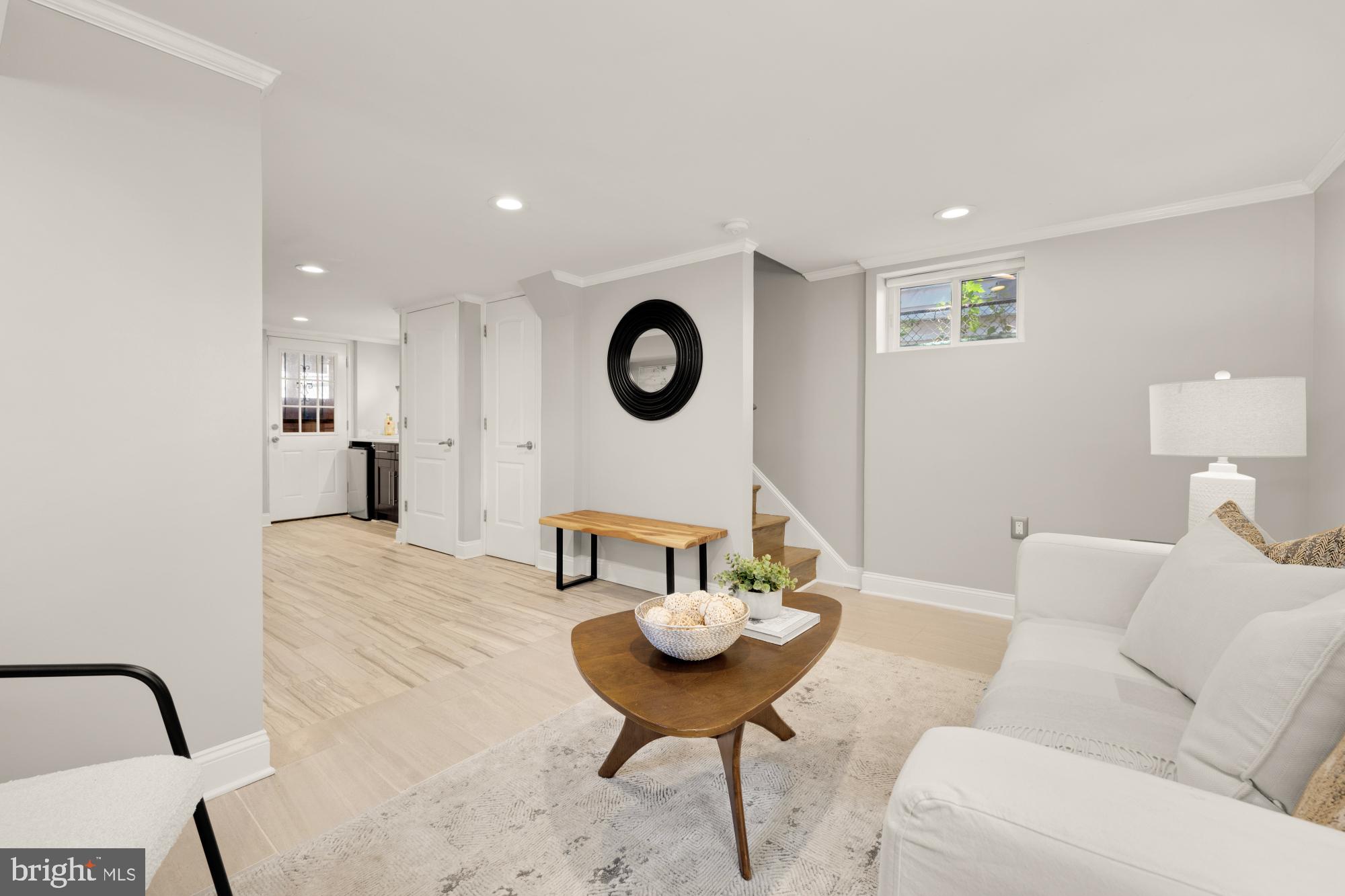 2414 Perry Street Northeast Washington, DC 20018 - Photo 37 of 49 a living room with furniture and a wall painting