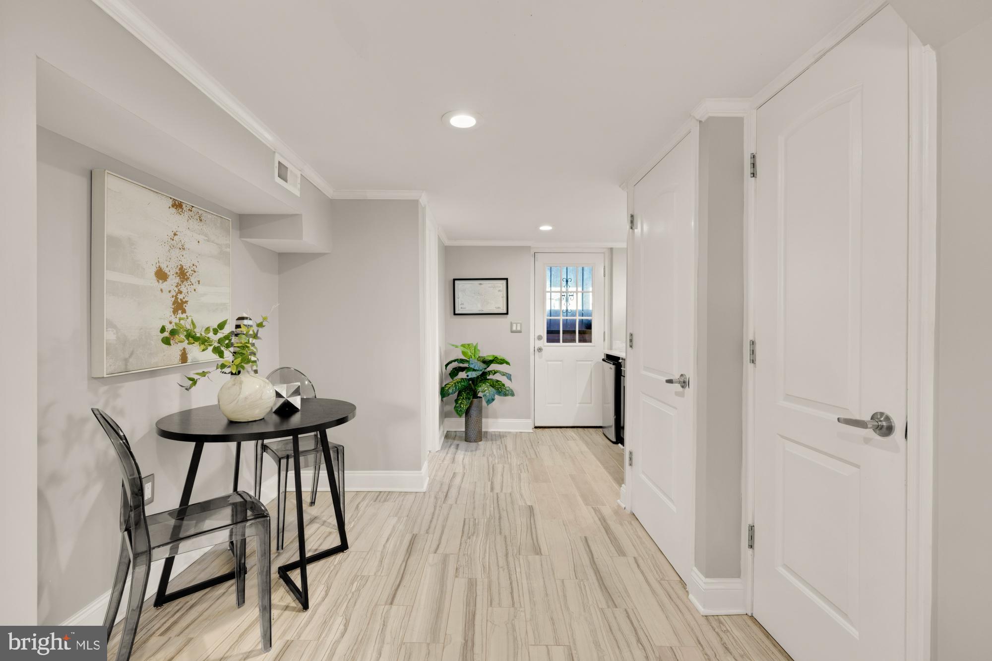 2414 Perry Street Northeast Washington, DC 20018 - Photo 38 of 49 a view of a room with furniture and wooden floor