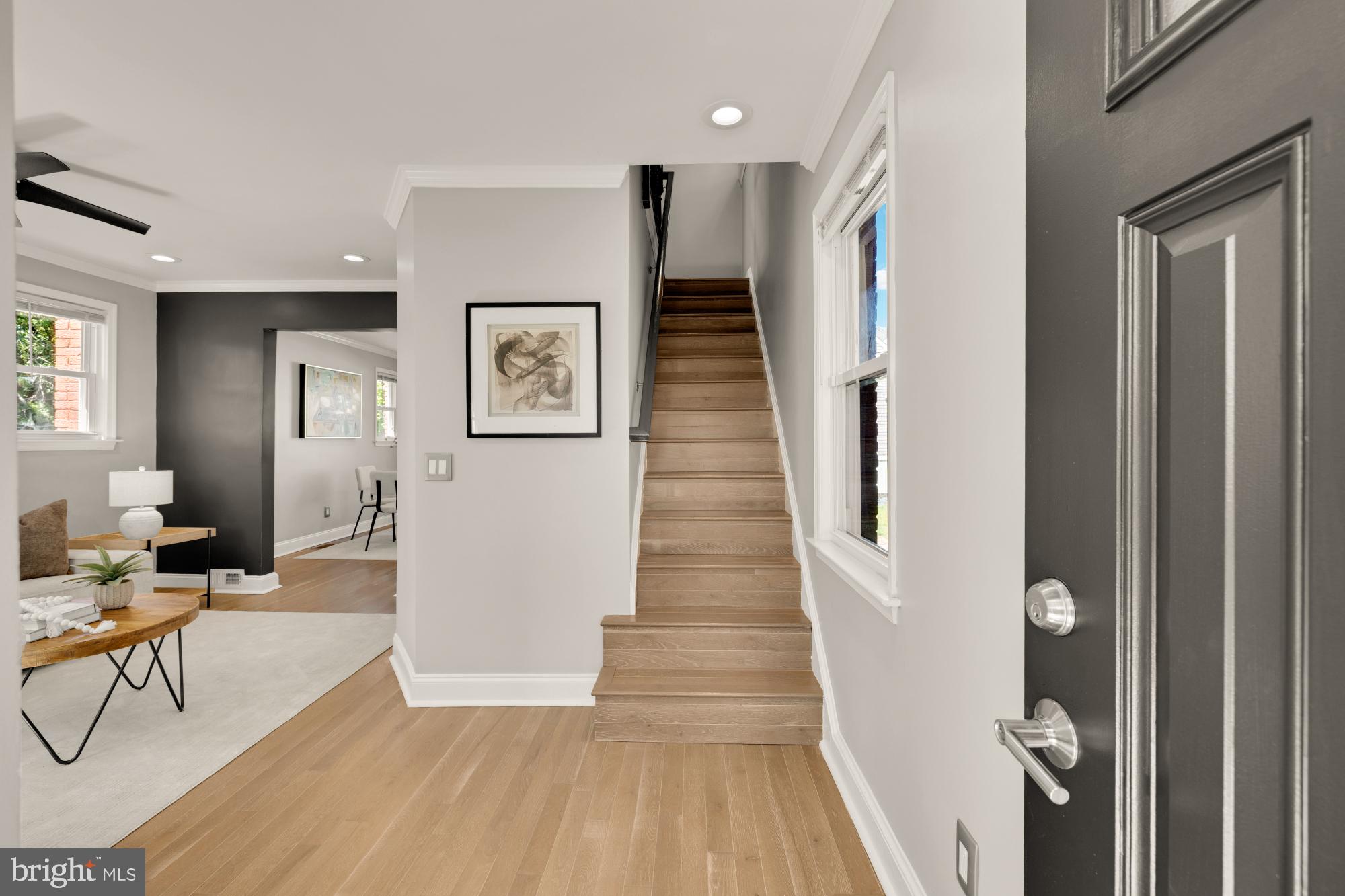 2414 Perry Street Northeast Washington, DC 20018 - Photo 4 of 49 a hallway with wooden floor and furniture