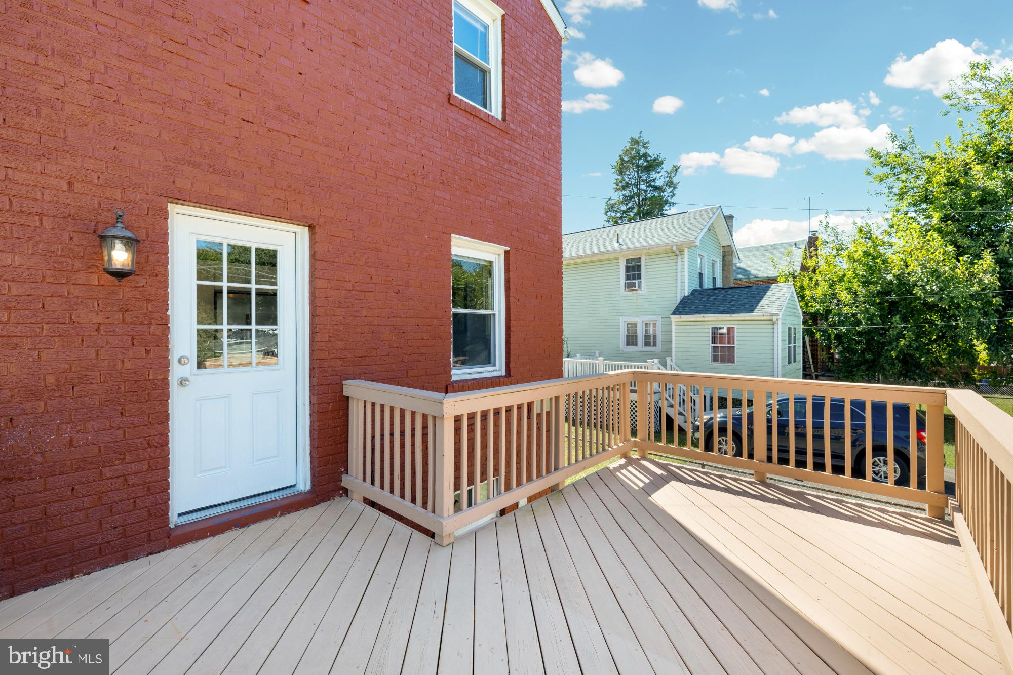2414 Perry Street Northeast Washington, DC 20018 - Photo 46 of 49 a view of porch with deck wooden floor and outdoor seating