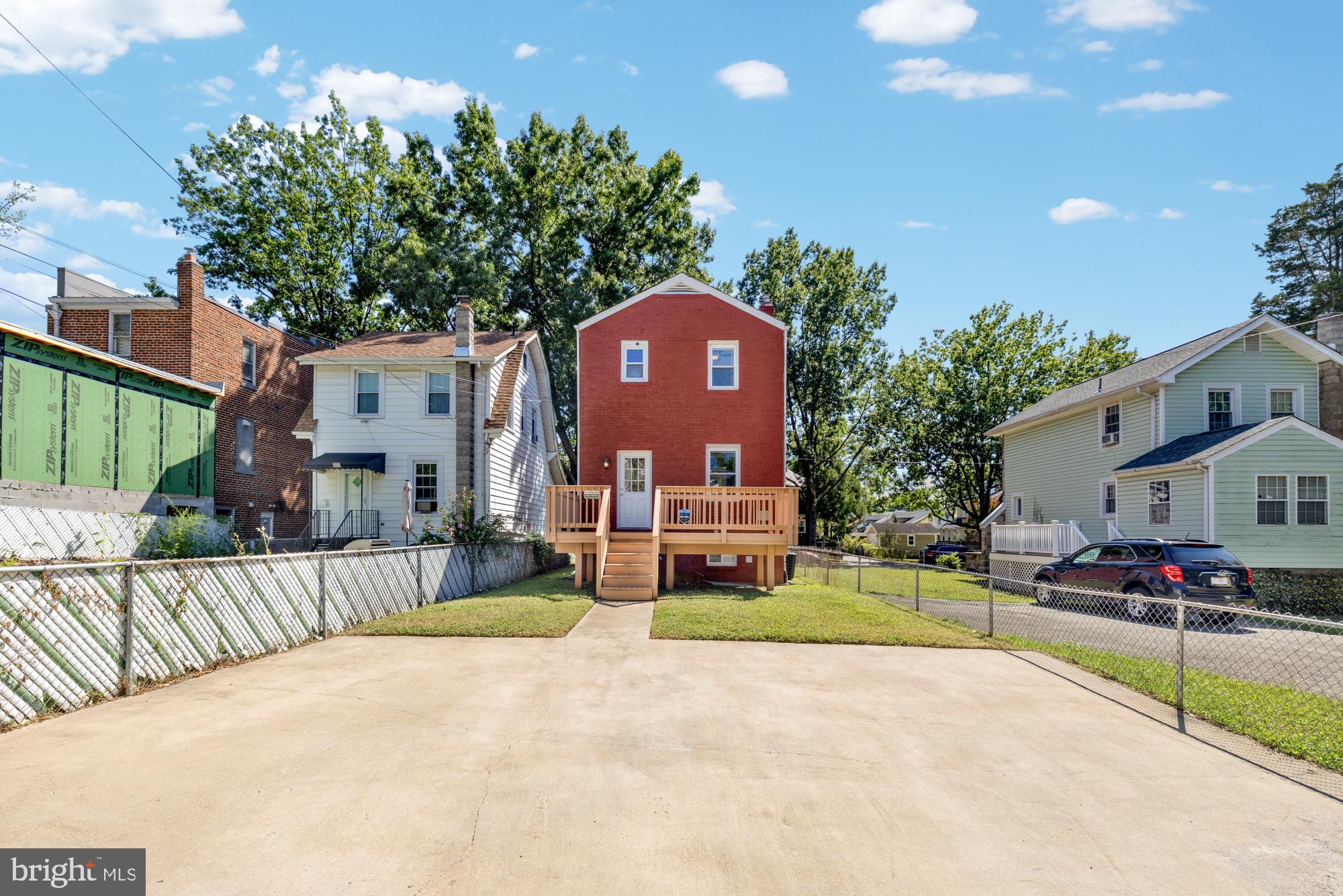 2414 Perry Street Northeast Washington, DC 20018 - Photo 49 of 49 a front view of a house with a yard and garage