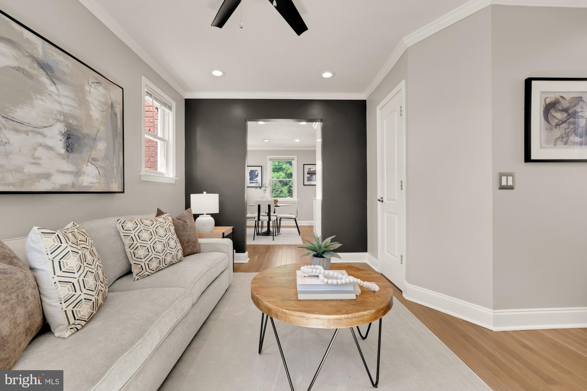 2414 Perry Street Northeast Washington, DC 20018 - Photo 8 of 49 a living room with furniture and a wooden floor