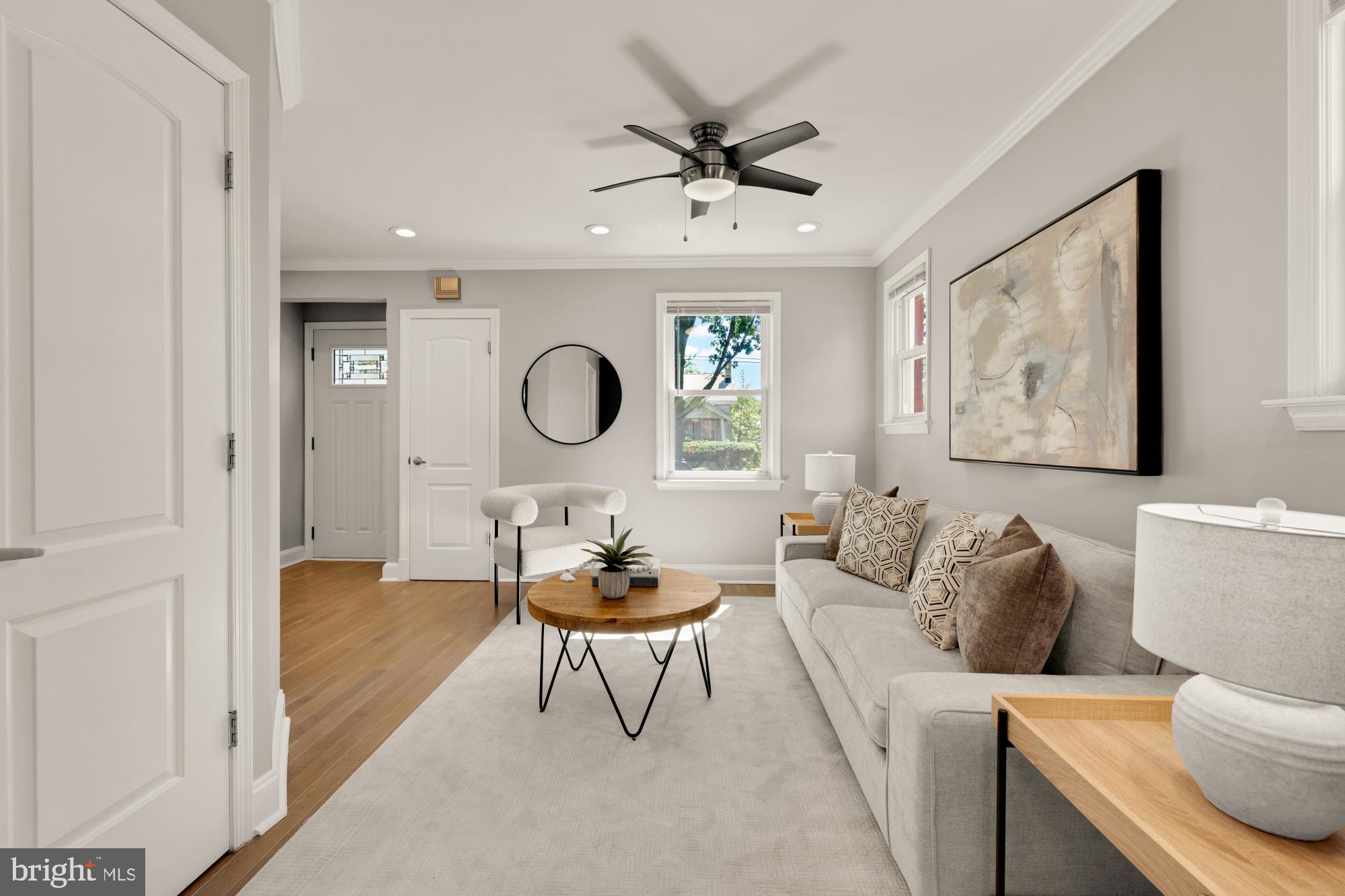 2414 Perry Street Northeast Washington, DC 20018 - Photo 10 of 49 a living room with furniture and a clock