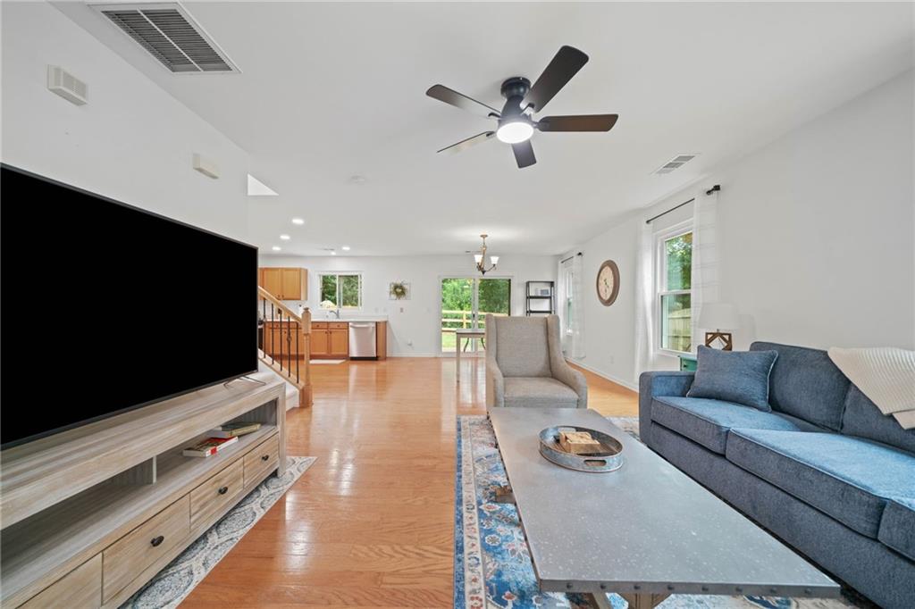 151 Nacoochee Way Canton, GA 30114 - Photo 11 of 36 a living room with furniture and a flat screen tv