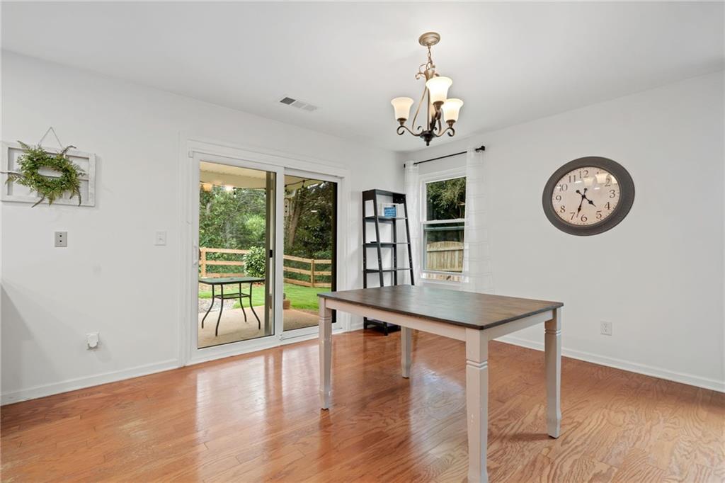 151 Nacoochee Way Canton, GA 30114 - Photo 13 of 36 a view of a room with furniture large window and wooden floor