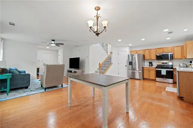 a view of kitchen with furniture and a chandelier