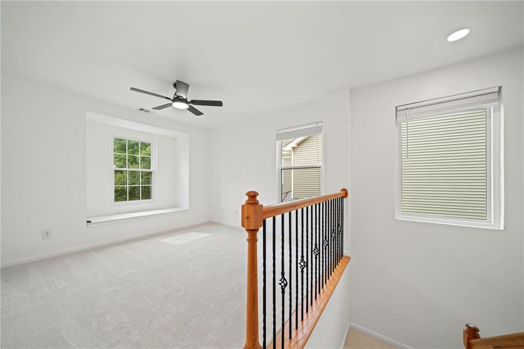 151 Nacoochee Way Canton, GA 30114 - Photo 21 of 36 an empty room with windows