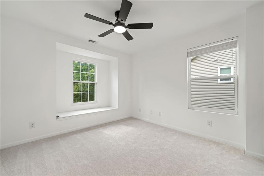 151 Nacoochee Way Canton, GA 30114 - Photo 22 of 36 an empty room with a window