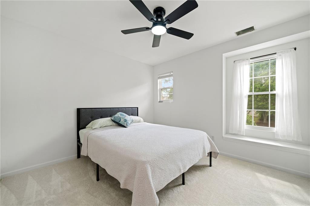 151 Nacoochee Way Canton, GA 30114 - Photo 24 of 36 a bedroom with a bed and a window