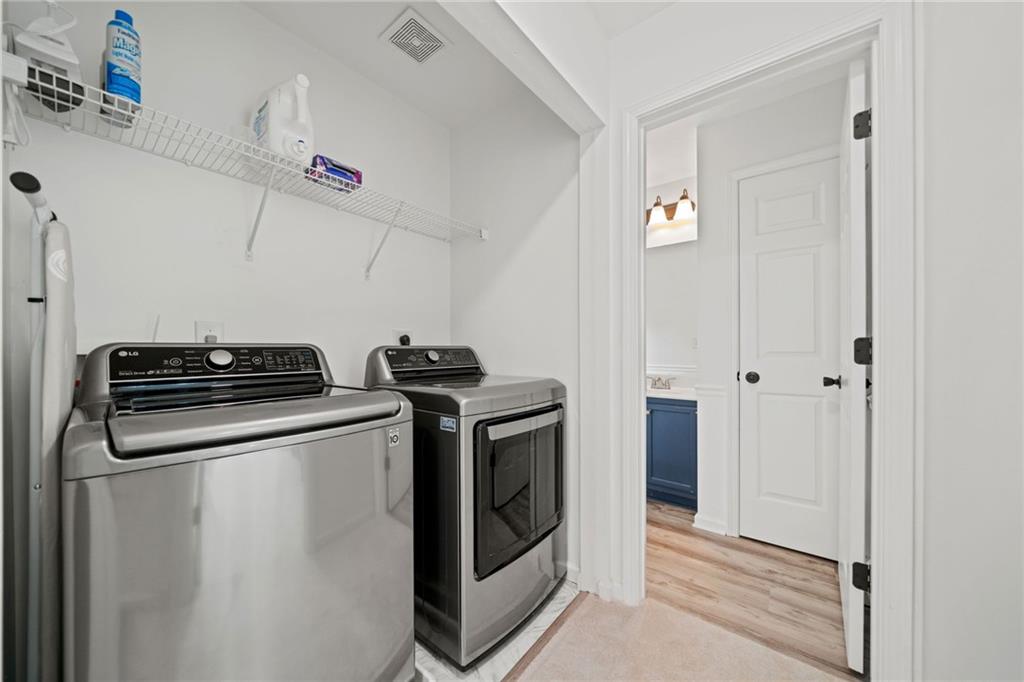 151 Nacoochee Way Canton, GA 30114 - Photo 26 of 36 a utility room with dryer and washer