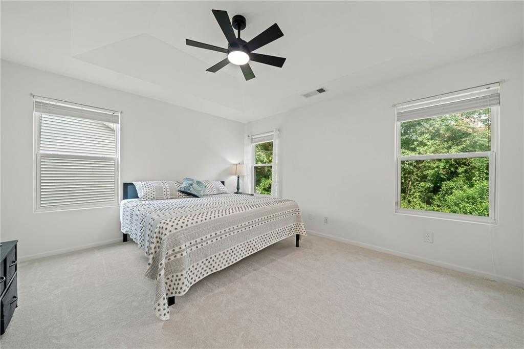 151 Nacoochee Way Canton, GA 30114 - Photo 28 of 36 a bedroom with a bed and a window