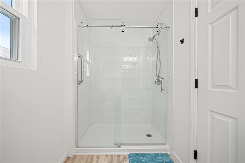 151 Nacoochee Way Canton, GA 30114 - Photo 31 of 36 a bathroom with a shower