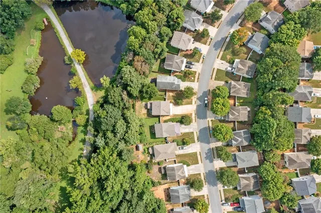 an aerial view of residential houses with plants