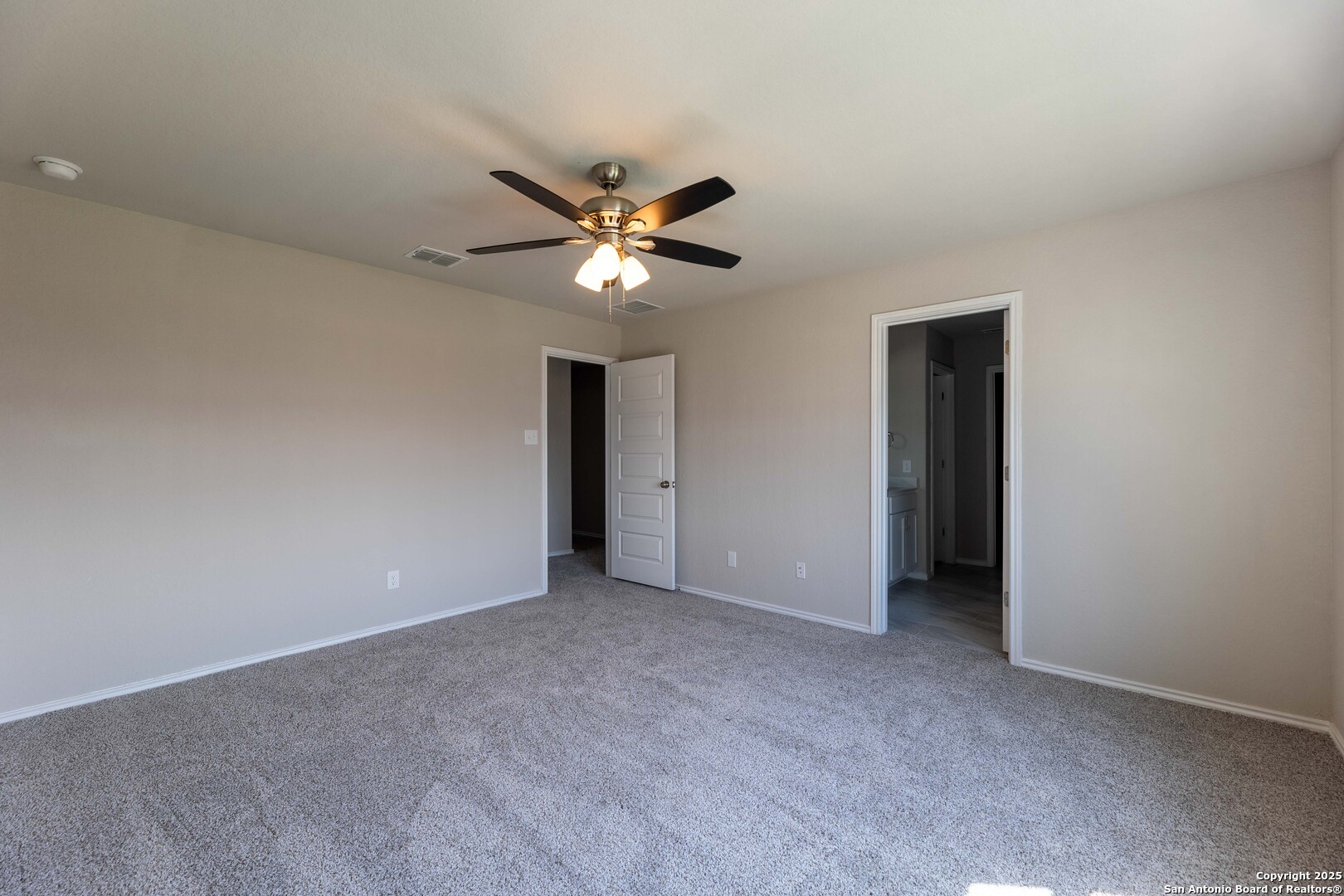 4211 Brigade Bend Converse, TX 78109 - Photo 16 of 30 a view of an empty room with a ceiling fan