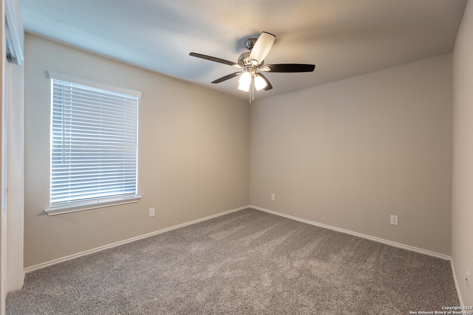 4211 Brigade Bend Converse, TX 78109 - Photo 22 of 30 an empty room with a window and a fan