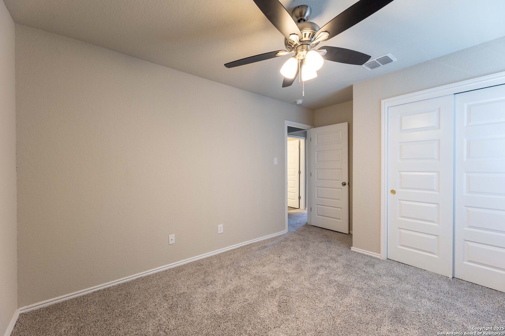 4211 Brigade Bend Converse, TX 78109 - Photo 23 of 30 an empty room with closet and a ceiling fan