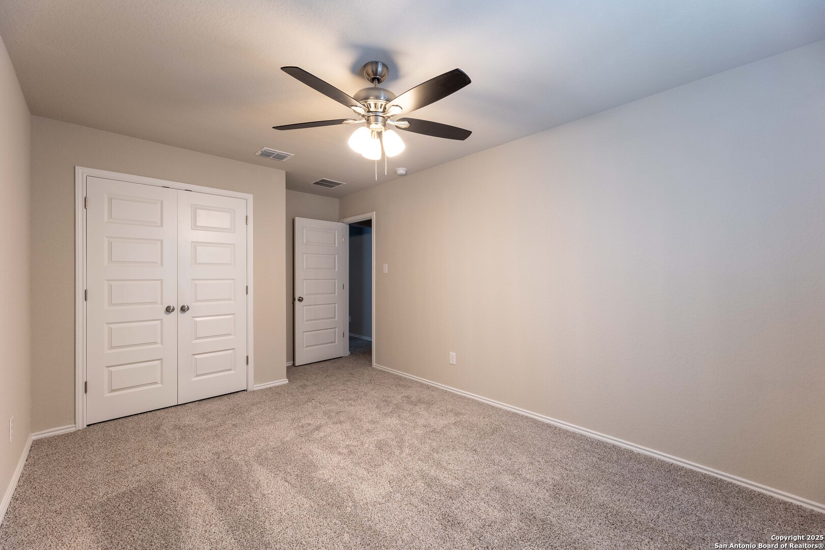 4211 Brigade Bend Converse, TX 78109 - Photo 24 of 30 an empty room with closet and fan