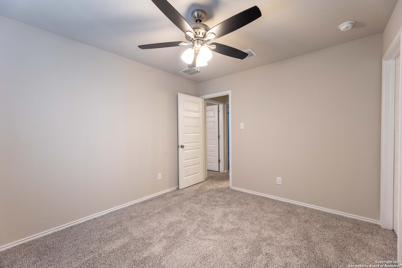 4211 Brigade Bend Converse, TX 78109 - Photo 27 of 30 an empty room with closet and a ceiling fan