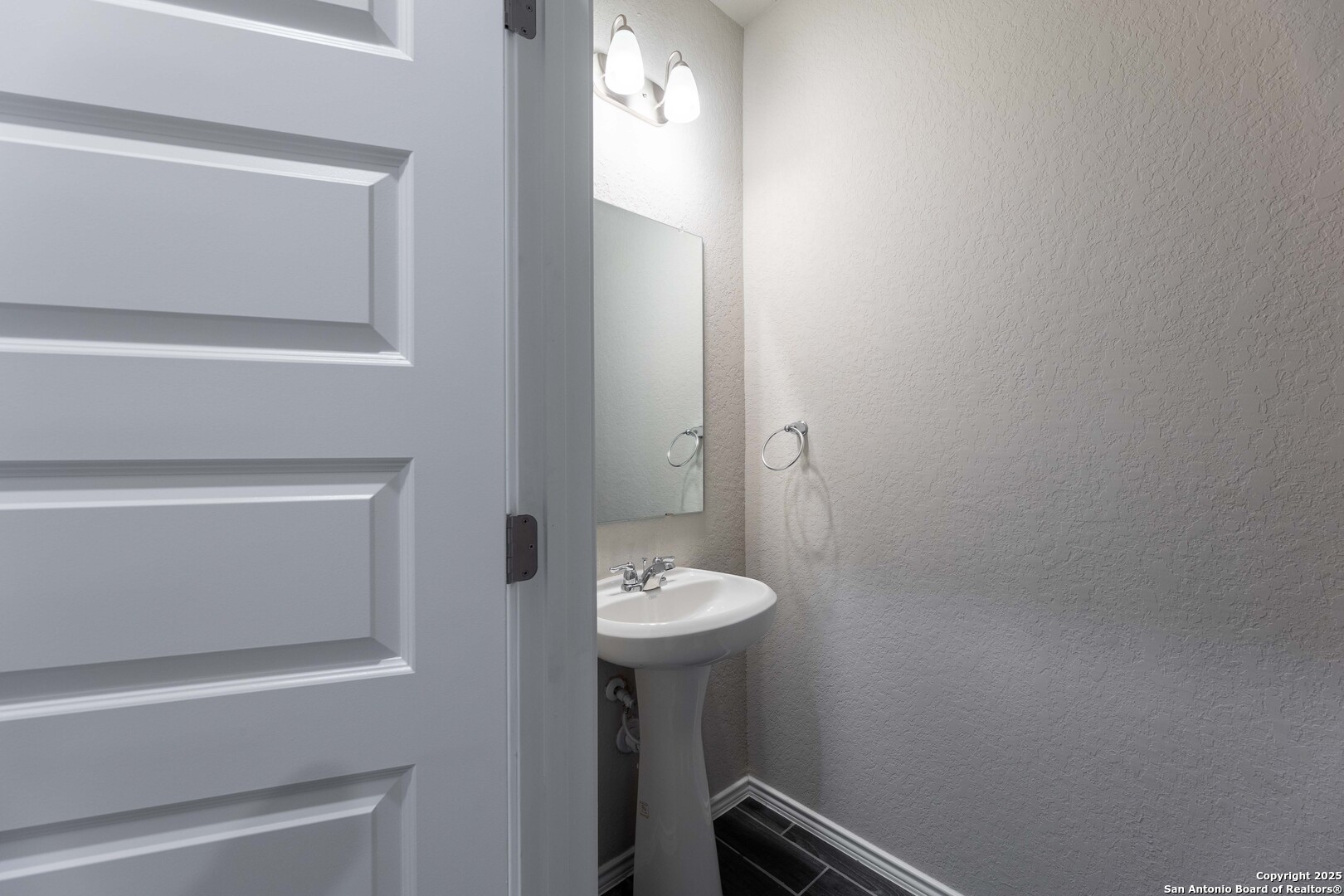 4211 Brigade Bend Converse, TX 78109 - Photo 3 of 30 a bathroom with a sink a toilet and mirror