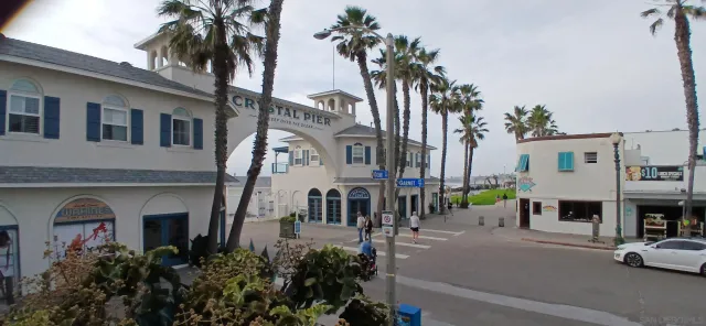 a couple of cars parked in front of a building