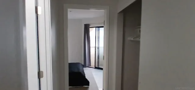 a view of a closet and mirror