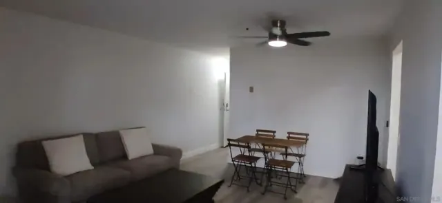 a living room with furniture and a lamp