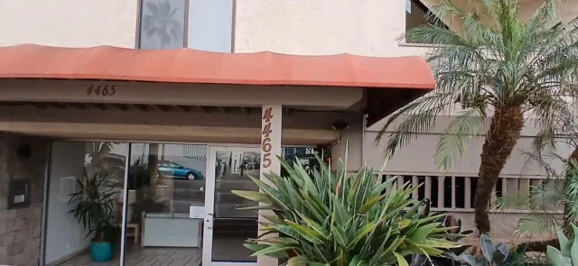 a view of a house with a flower garden