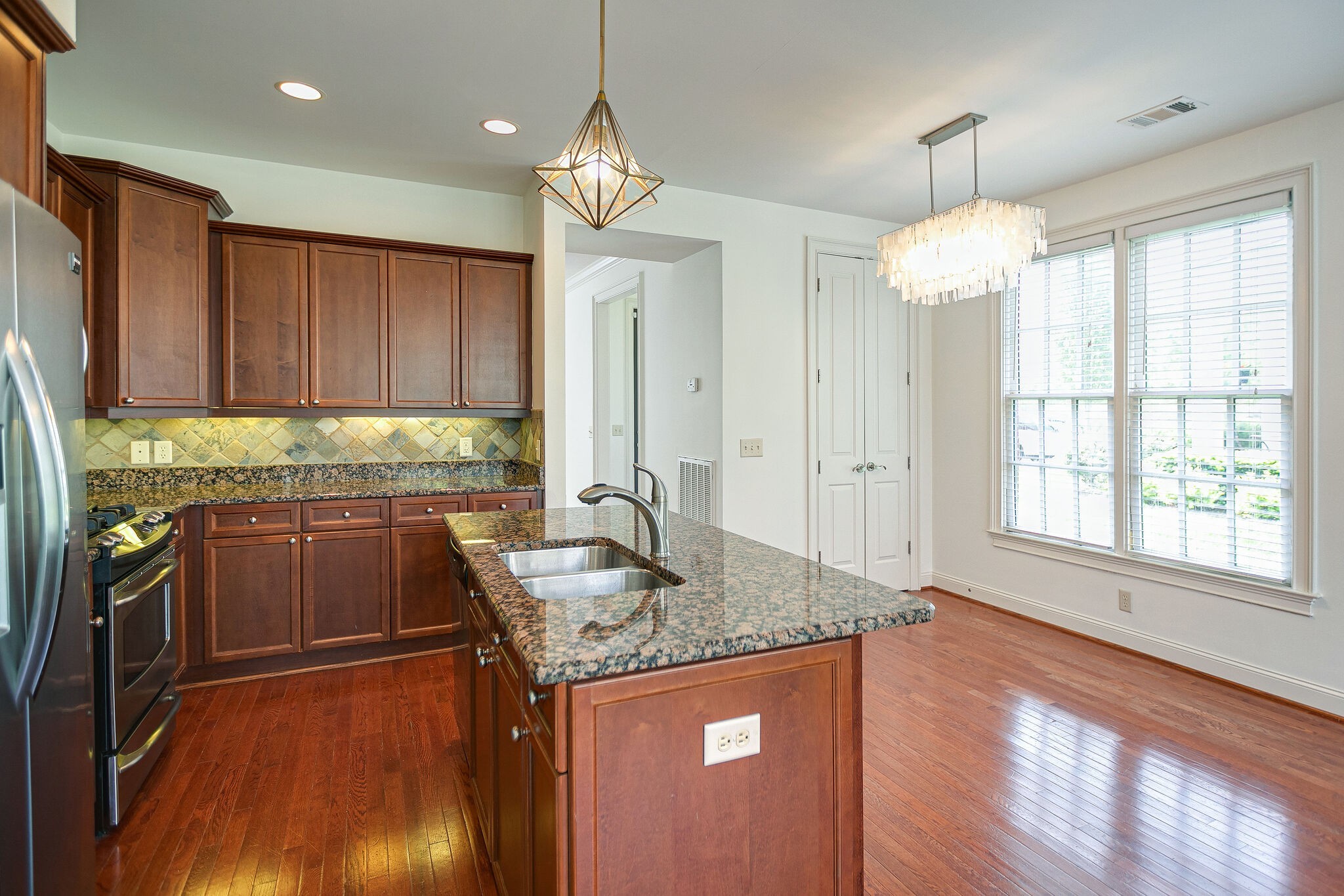1407 Moher Boulevard Franklin, TN 37069 - Photo 19 of 40 The star light fixture was replaced with the clear bell shaped one in the other kitchen photos.