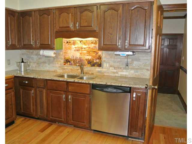 2215 Yorkgate Drive Raleigh, NC 27612 - Photo 9 of 24 Notice the beautiful tile accents above the sink. Cafeteria/Kitchen