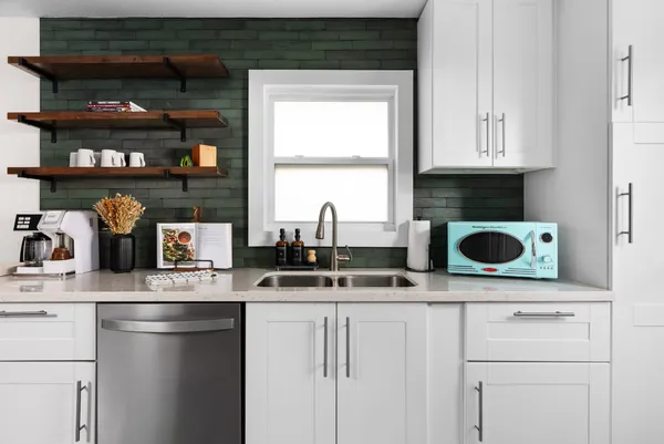 a kitchen with a sink and a stove